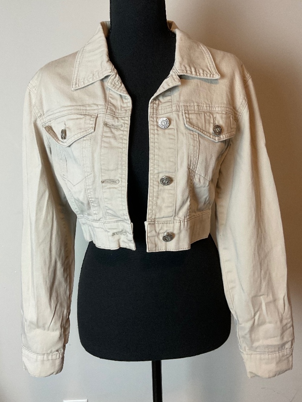 Heat Wave Vintage cream cropped denim jacket.